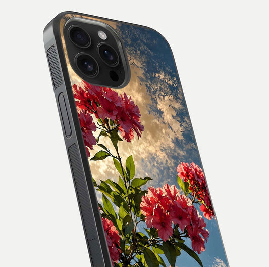 Red Bloom Skies Glass Case for iPhone 16 Pro Max close-up angled shot highlighting detailed blooms and reflection