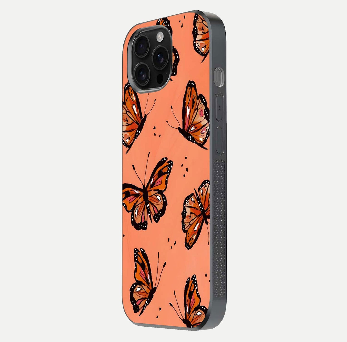 Coral Wing Butterfly Glass Case for iPhone 16 Pro Max side-angle photo showing reflective finish and smooth edges