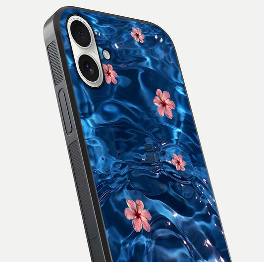 Blooming Water Drift Glass Case for iPhone 17 close-up angle showing petal details, soft aqua tones, and smooth gloss reflection