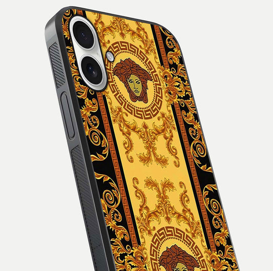 Golden Royal Heritage Glass Case for iPhone 17 close-up angled shot showing intricate design and metallic reflection