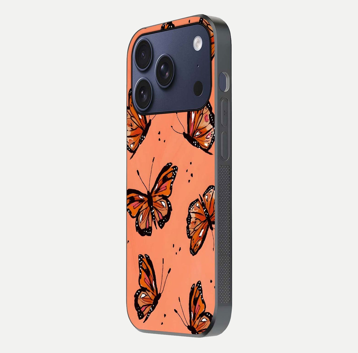 Coral Wing Butterfly Glass Case for iPhone 17 Pro side-angle photo showing reflective finish and smooth edges