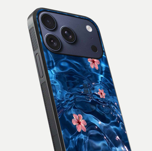 Blooming Water Drift Glass Case for iPhone 17 Pro close-up angle showing petal details, soft aqua tones, and smooth gloss reflection