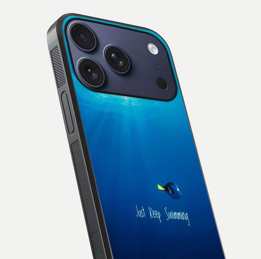 Just Keep Swimming Glass Case for iPhone 17 Pro close-up angled shot showing elegant lettering and blue tone reflection