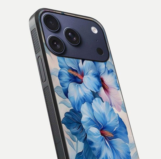 Ocean Hibiscus Grace Glass Case for iPhone 17 Pro close-up angled shot highlighting floral glow and HD shine
