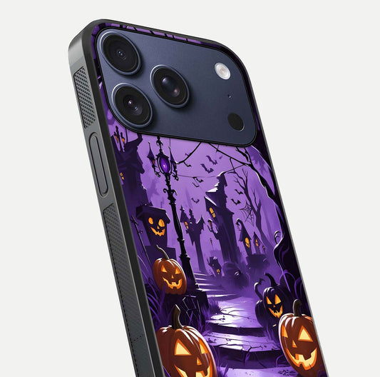 Pumpkin Patch Halloween Glass Case for iPhone 17 Pro close-up angled shot highlighting pumpkin texture and shine