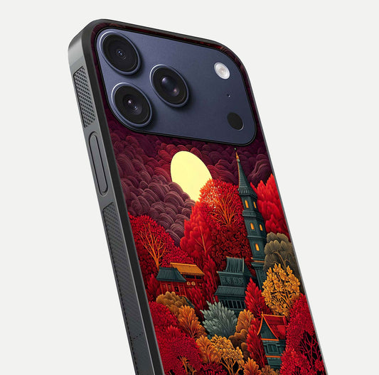 Scarlet Autumn Temple Glass Case for iPhone 17 Pro close-up angled shot highlighting golden leaves and reflection