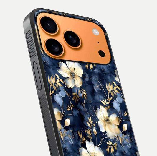 Golden Midnight Bloom Glass Case for iPhone 17 Pro Max close-up angled shot showing floral detail and reflection shine