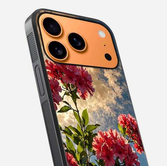 Red Bloom Skies Glass Case for iPhone 17 Pro Max close-up angled shot highlighting detailed blooms and reflection