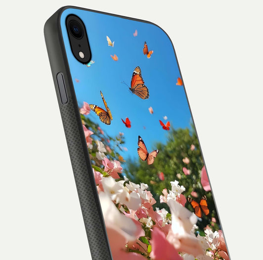 Butterflies in Bloom Sky Glass Case for iPhone X close-up shot showing wings, petal reflections, and soft hues