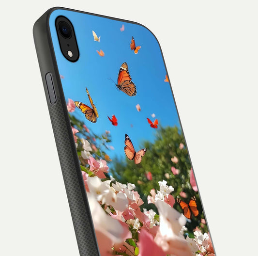 Butterflies in Bloom Sky Glass Case for iPhone Xr close-up shot showing wings, petal reflections, and soft hues