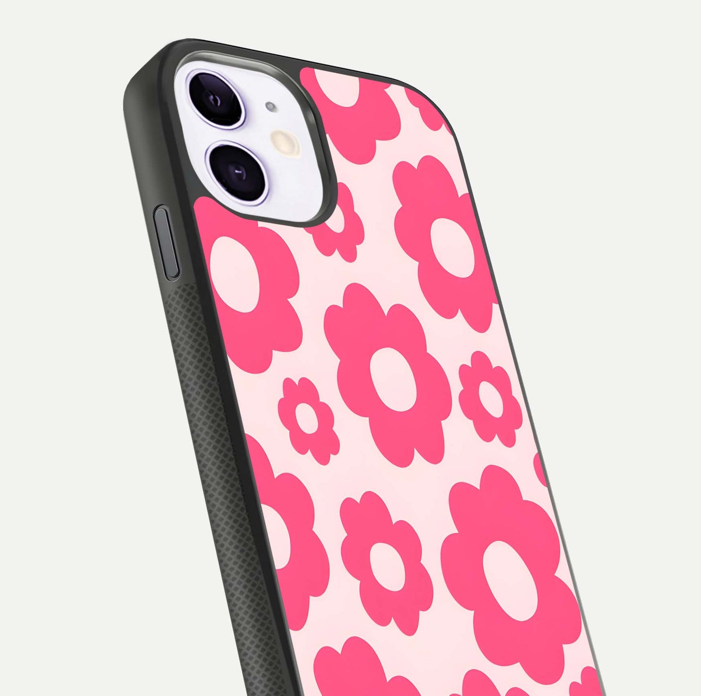 Blush Flower Pop iPhone 11 glass phone case angled back view highlighting bright floral pop design and side grip texture