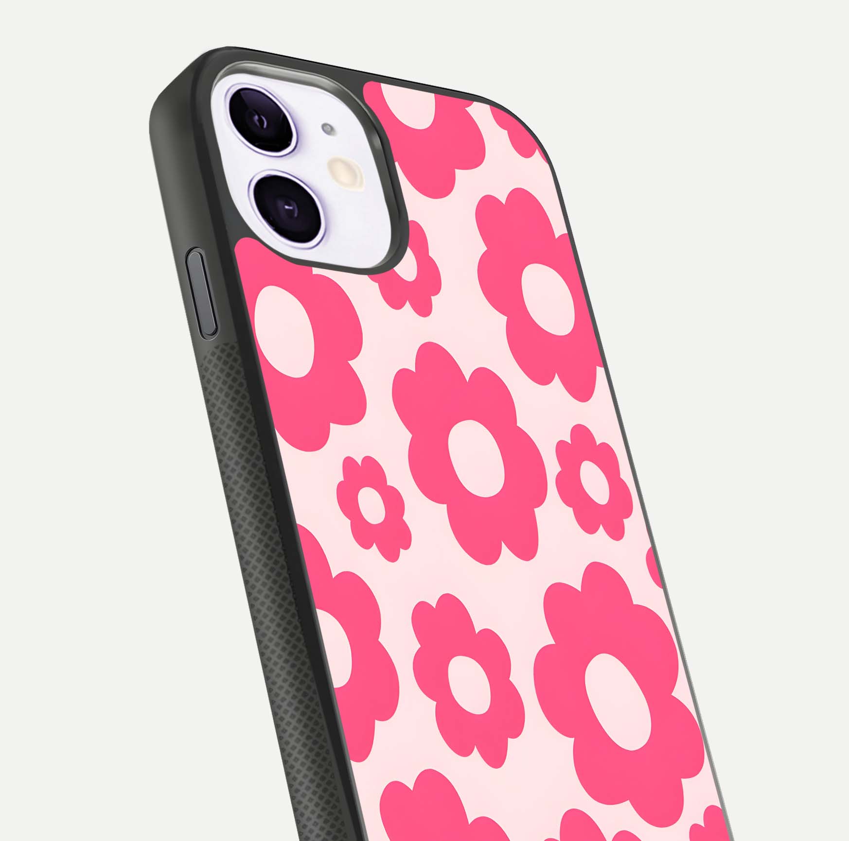 Blush Flower Pop iPhone 11 glass phone case angled back view highlighting bright floral pop design and side grip texture