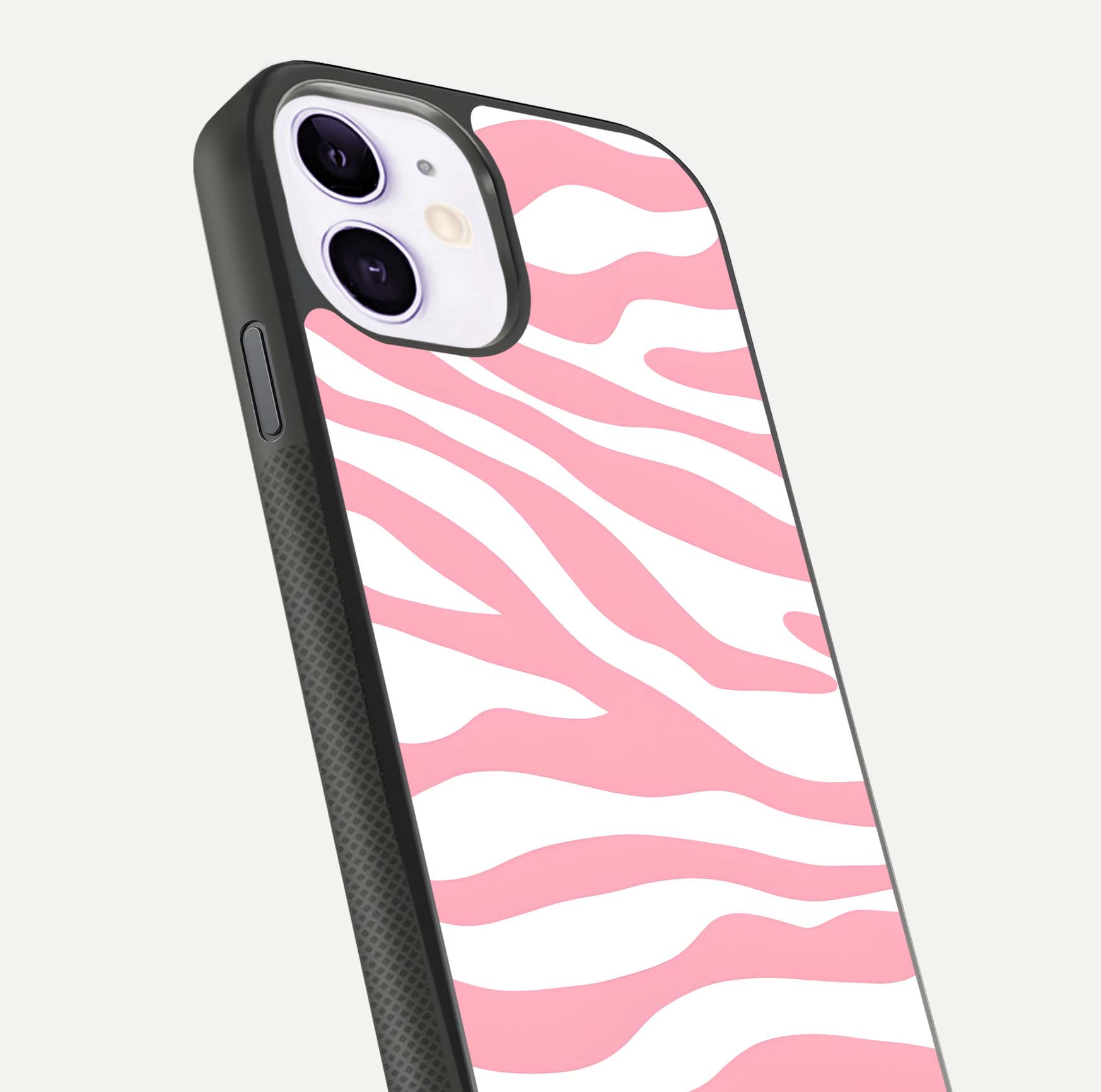 Blush Zebra Flow iPhone 11 glass phone case angled back view highlighting bold zebra artwork and textured side grip