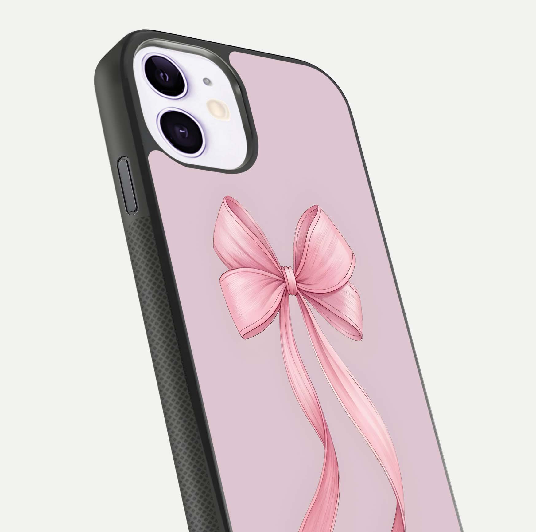 Soft Blush Bow iPhone 11 glass phone case angled back view highlighting bow artwork and side grip texture