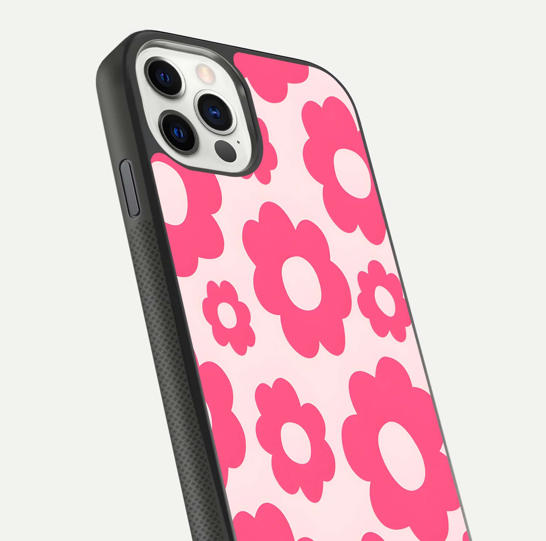 Blush Flower Pop iPhone 11 Pro glass phone case angled back view highlighting bright floral pop design and side grip texture