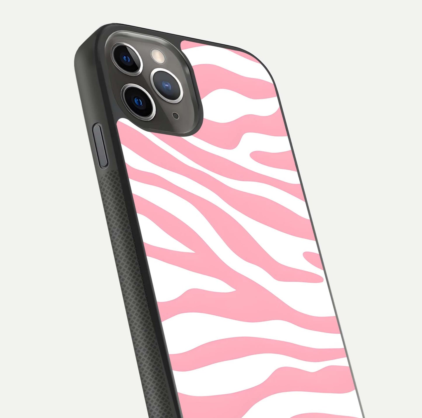 Blush Zebra Flow iPhone 11 Pro Max glass phone case angled back view highlighting bold zebra artwork and textured side grip