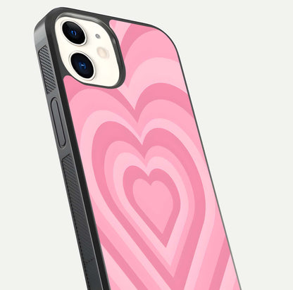 Blush Heart Waves iPhone 12 glass phone case angled back view highlighting romantic heart wave artwork and grip texture