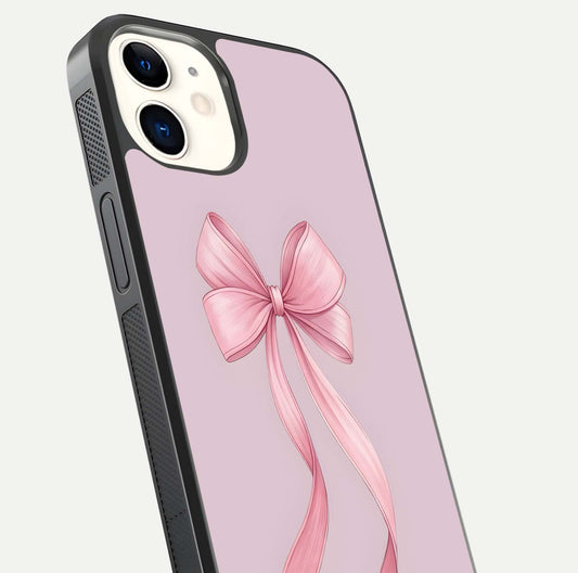 Soft Blush Bow iPhone 12 glass phone case angled back view highlighting bow artwork and side grip texture