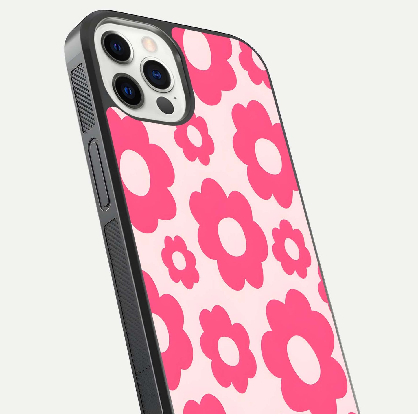 Blush Flower Pop iPhone 12 Pro glass phone case angled back view highlighting bright floral pop design and side grip texture