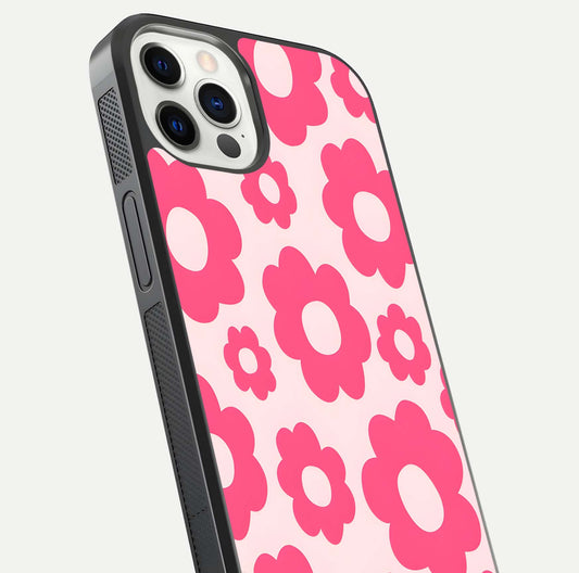 Blush Flower Pop iPhone 12 Pro glass phone case angled back view highlighting bright floral pop design and side grip texture