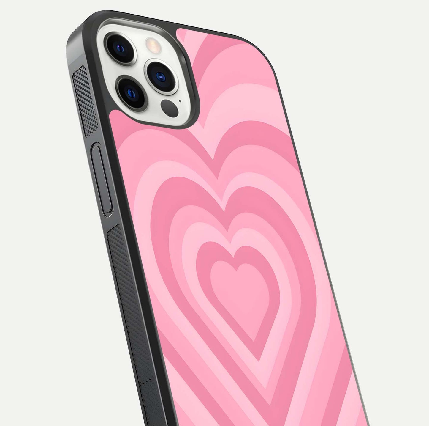 Blush Heart Waves iPhone 12 Pro glass phone case angled back view highlighting romantic heart wave artwork and grip texture