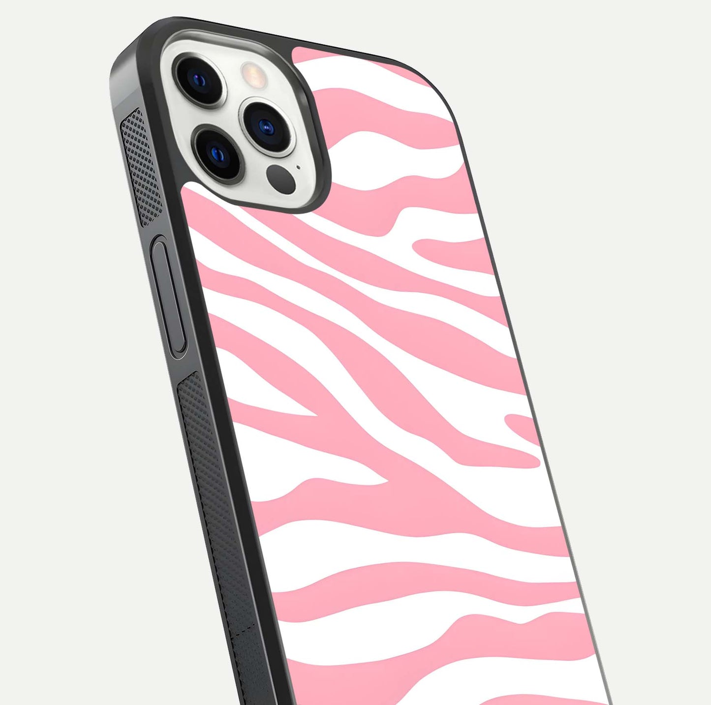 Blush Zebra Flow iPhone 12 Pro glass phone case angled back view highlighting bold zebra artwork and textured side grip