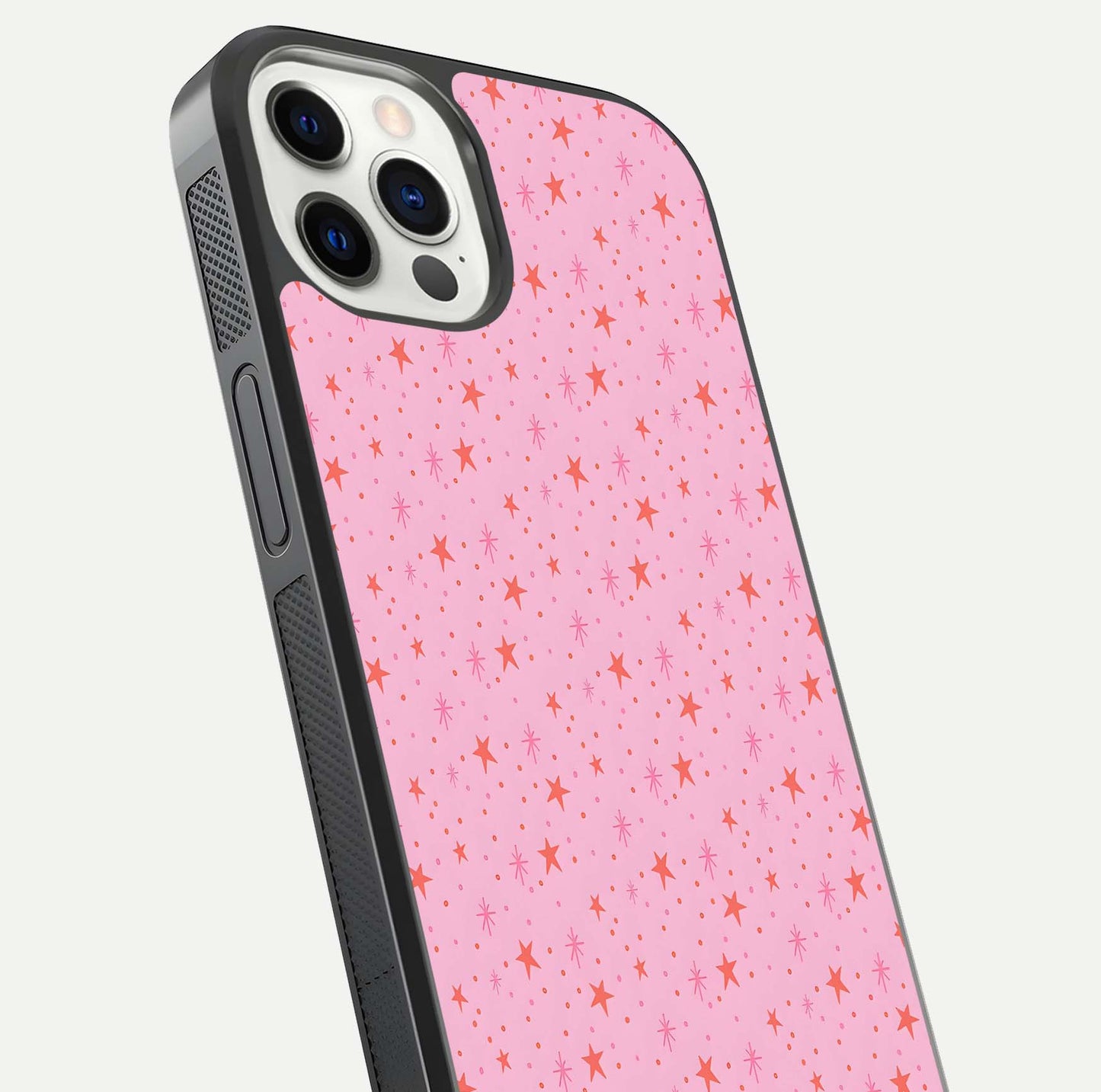 Cosmic Pink Sparkle iPhone 12 Pro glass phone case angled back view highlighting sparkling galaxy design and textured side grip