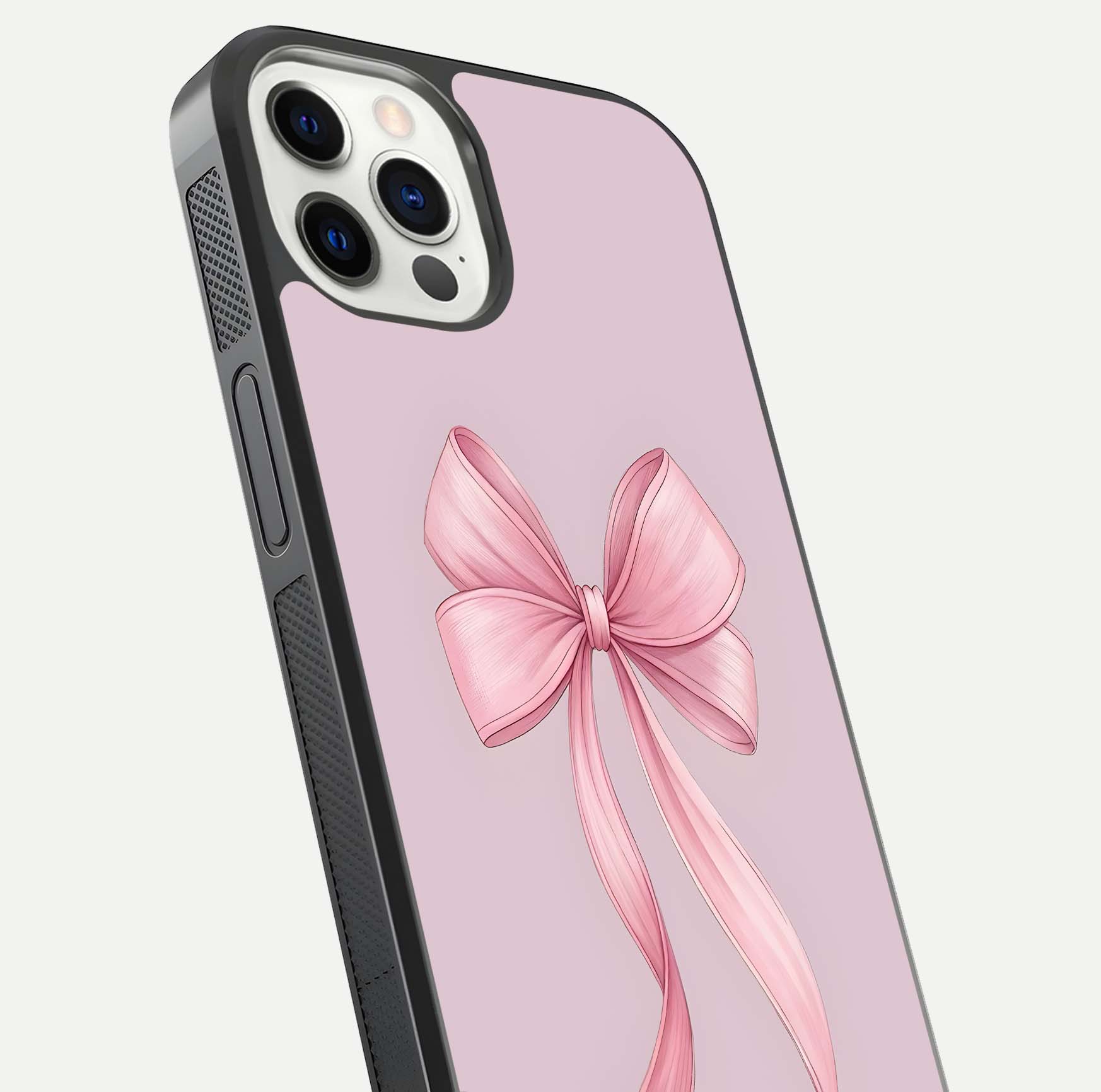 Soft Blush Bow iPhone 12 Pro glass phone case angled back view highlighting bow artwork and side grip texture