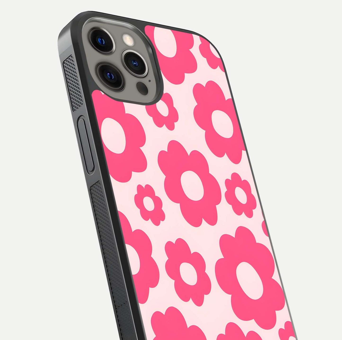 Blush Flower Pop iPhone 12 Pro Max glass phone case angled back view highlighting bright floral pop design and side grip texture