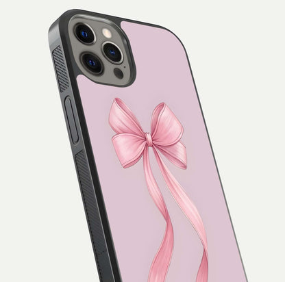 Soft Blush Bow iPhone 12 Pro Max glass phone case angled back view highlighting bow artwork and side grip texture