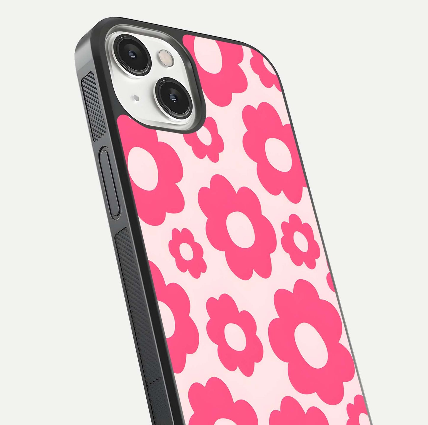 Blush Flower Pop iPhone 13 glass phone case angled back view highlighting bright floral pop design and side grip texture