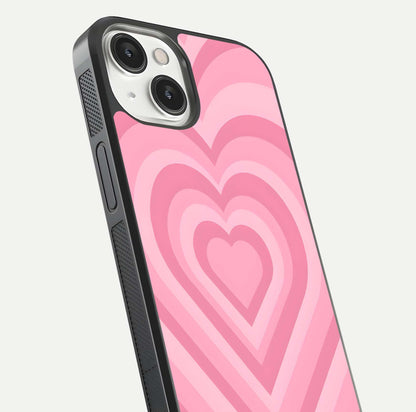 Blush Heart Waves iPhone 13 glass phone case angled back view highlighting romantic heart wave artwork and grip texture