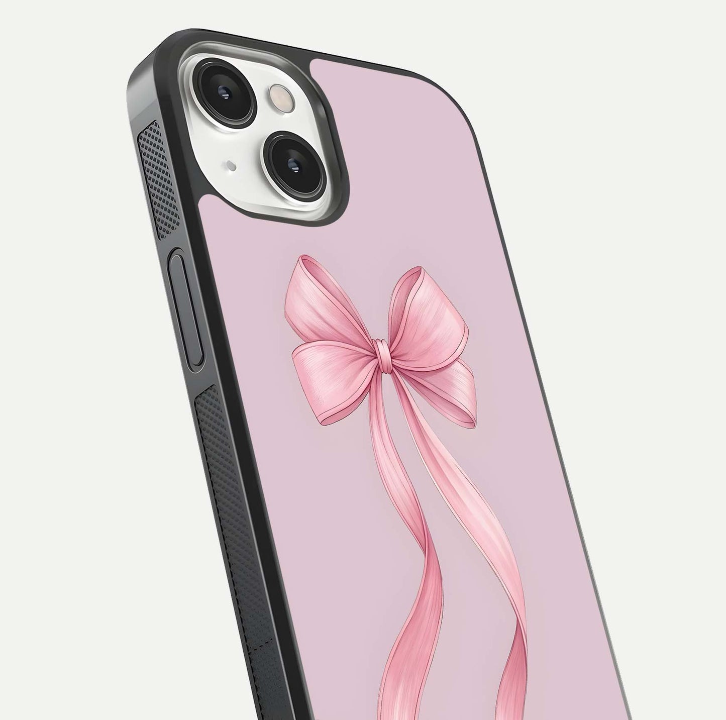 Soft Blush Bow iPhone 13 glass phone case angled back view highlighting bow artwork and side grip texture