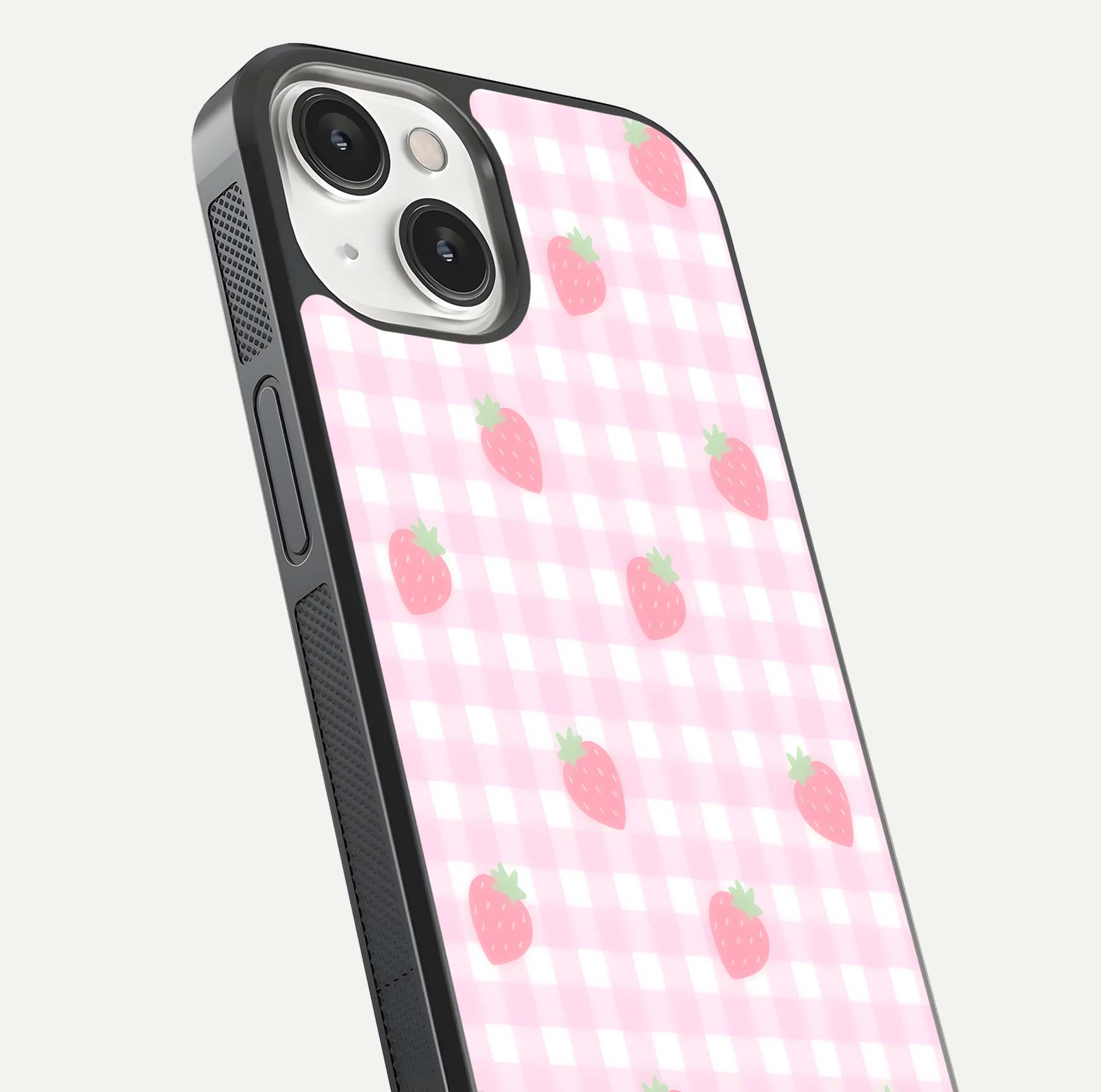 Strawberry Picnic Love iPhone 13 glass phone case angled back view highlighting strawberry illustrations and textured grip
