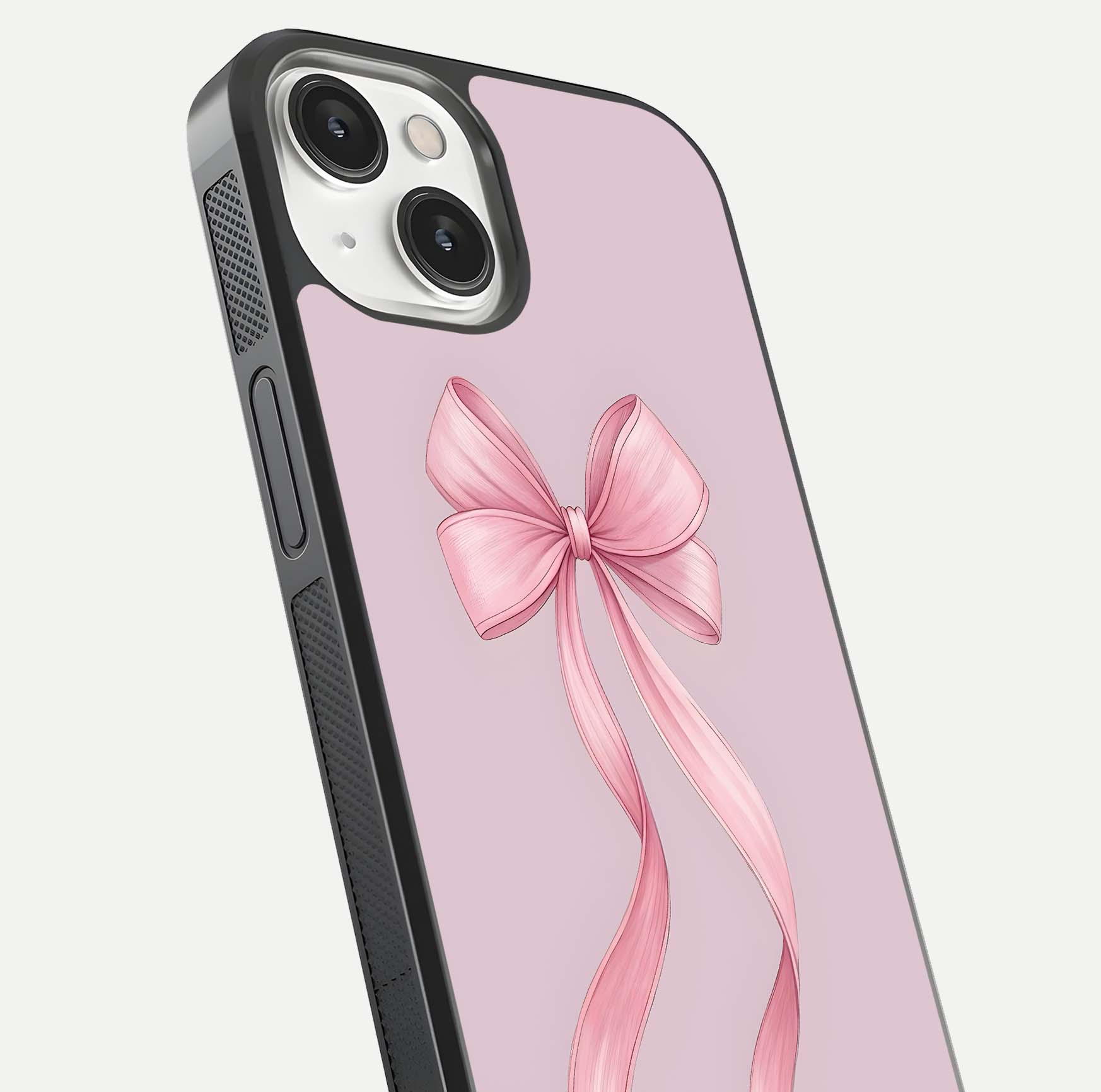 Soft Blush Bow iPhone 13 Mini glass phone case angled back view highlighting bow artwork and side grip texture