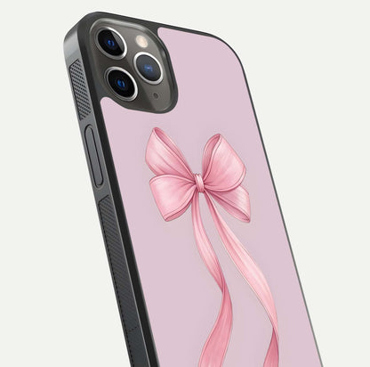 Soft Blush Bow iPhone 13 Pro glass phone case angled back view highlighting bow artwork and side grip texture