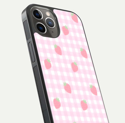 Strawberry Picnic Love iPhone 13 Pro glass phone case angled back view highlighting strawberry illustrations and textured grip
