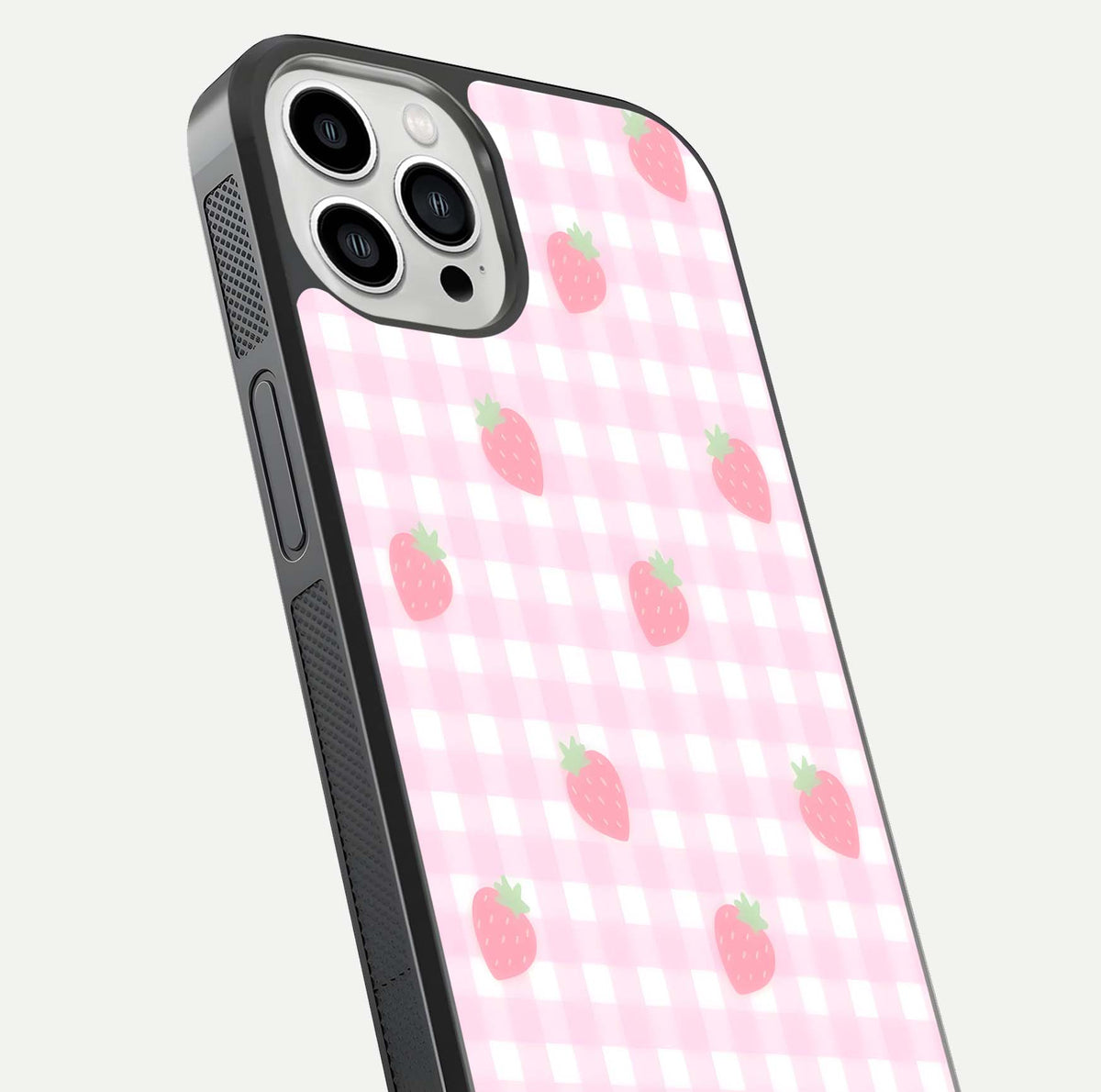 Strawberry Picnic Love iPhone 13 Pro Max glass phone case angled back view highlighting strawberry illustrations and textured grip
