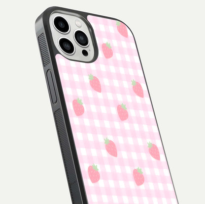 Strawberry Picnic Love iPhone 13 Pro Max glass phone case angled back view highlighting strawberry illustrations and textured grip