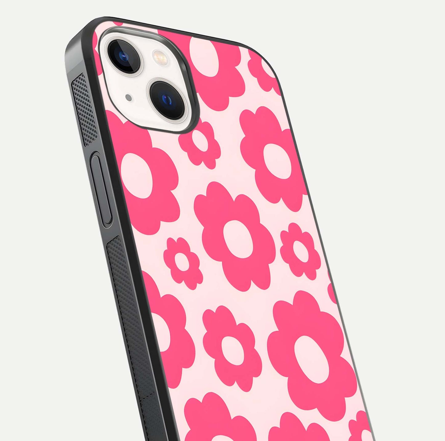 Blush Flower Pop iPhone 14 glass phone case angled back view highlighting bright floral pop design and side grip texture