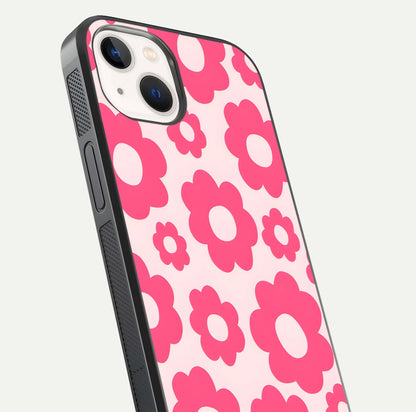 Blush Flower Pop iPhone 14 glass phone case angled back view highlighting bright floral pop design and side grip texture