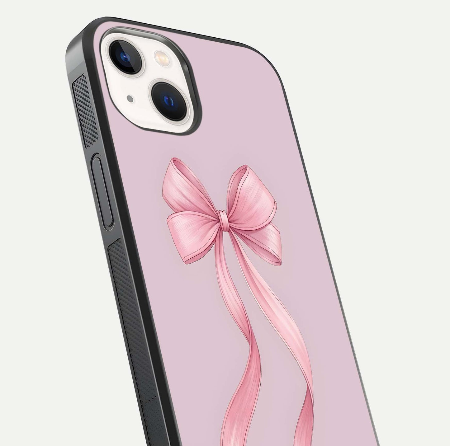Soft Blush Bow iPhone 14 glass phone case angled back view highlighting bow artwork and side grip texture