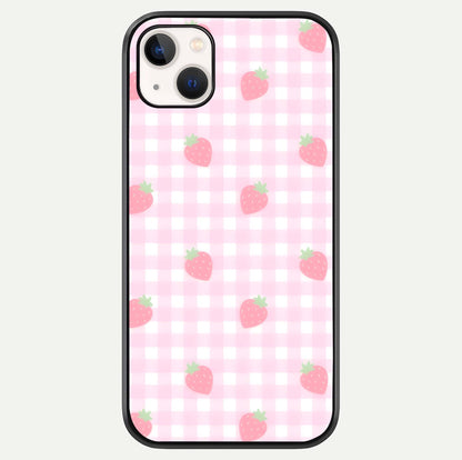 Strawberry Picnic Love iPhone 14 Plus glass phone case front view featuring cute strawberry picnic artwork with romantic vibe