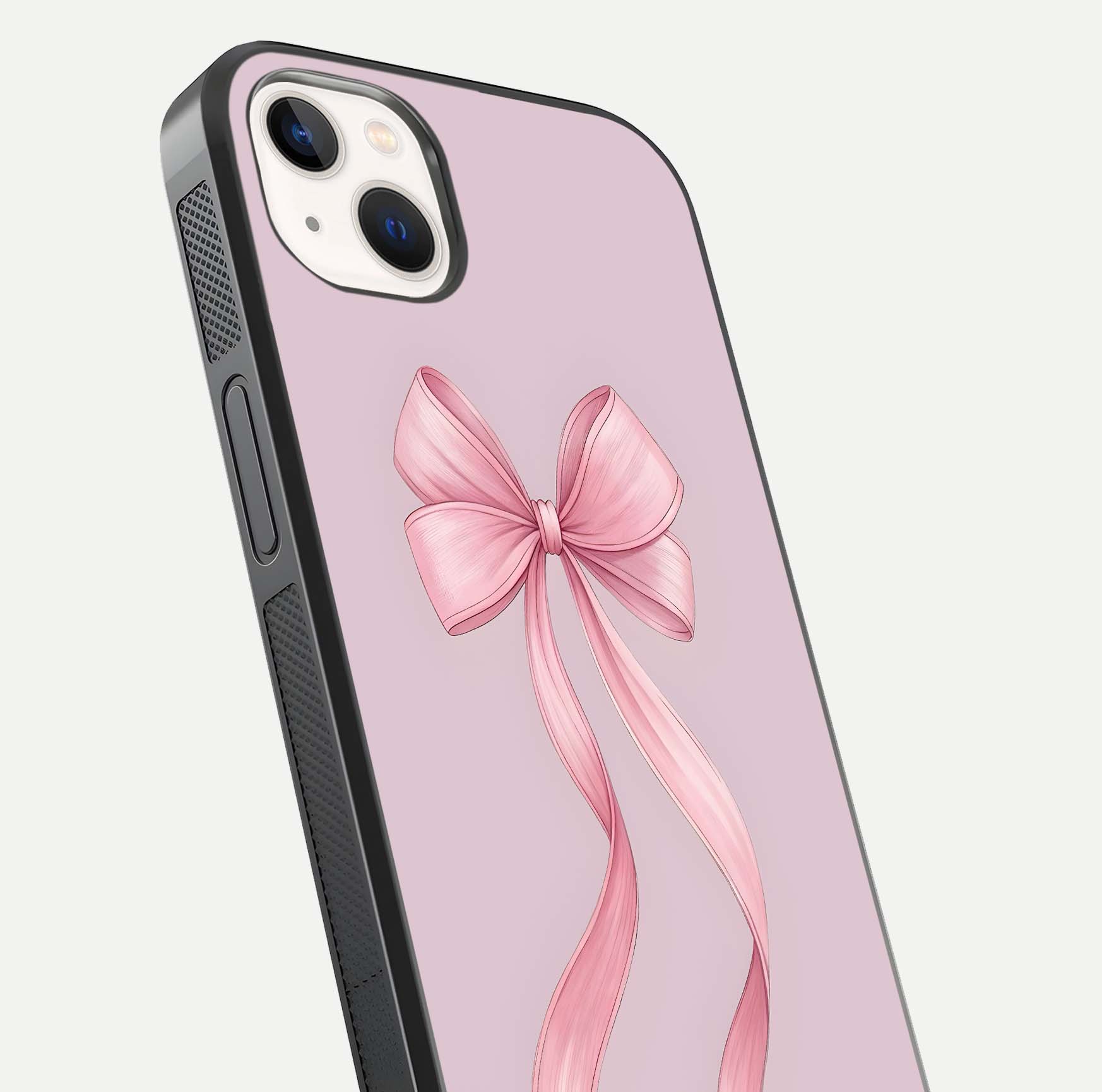 Soft Blush Bow iPhone 14 Plus glass phone case angled back view highlighting bow artwork and side grip texture