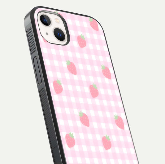 Strawberry Picnic Love iPhone 14 Plus glass phone case angled back view highlighting strawberry illustrations and textured grip