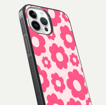 Blush Flower Pop iPhone 14 Pro glass phone case angled back view highlighting bright floral pop design and side grip texture