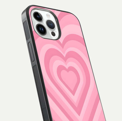 Blush Heart Waves iPhone 14 Pro glass phone case angled back view highlighting romantic heart wave artwork and grip texture
