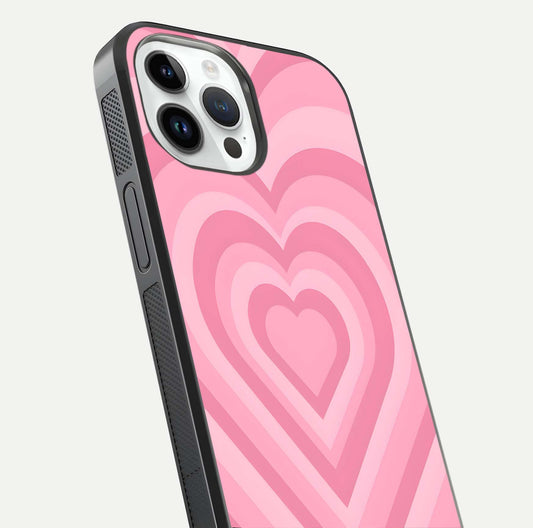 Blush Heart Waves iPhone 14 Pro glass phone case angled back view highlighting romantic heart wave artwork and grip texture