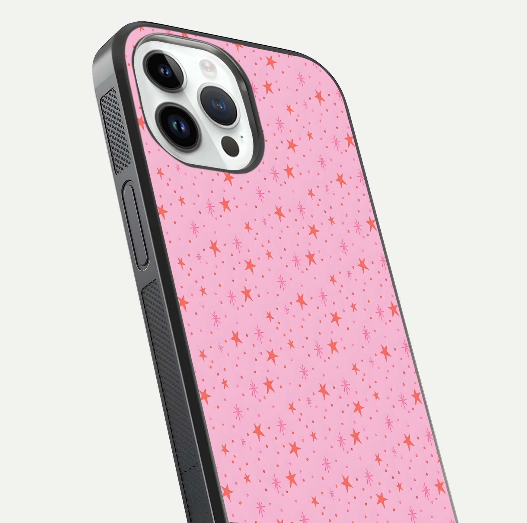 Cosmic Pink Sparkle iPhone 14 Pro glass phone case angled back view highlighting sparkling galaxy design and textured side grip