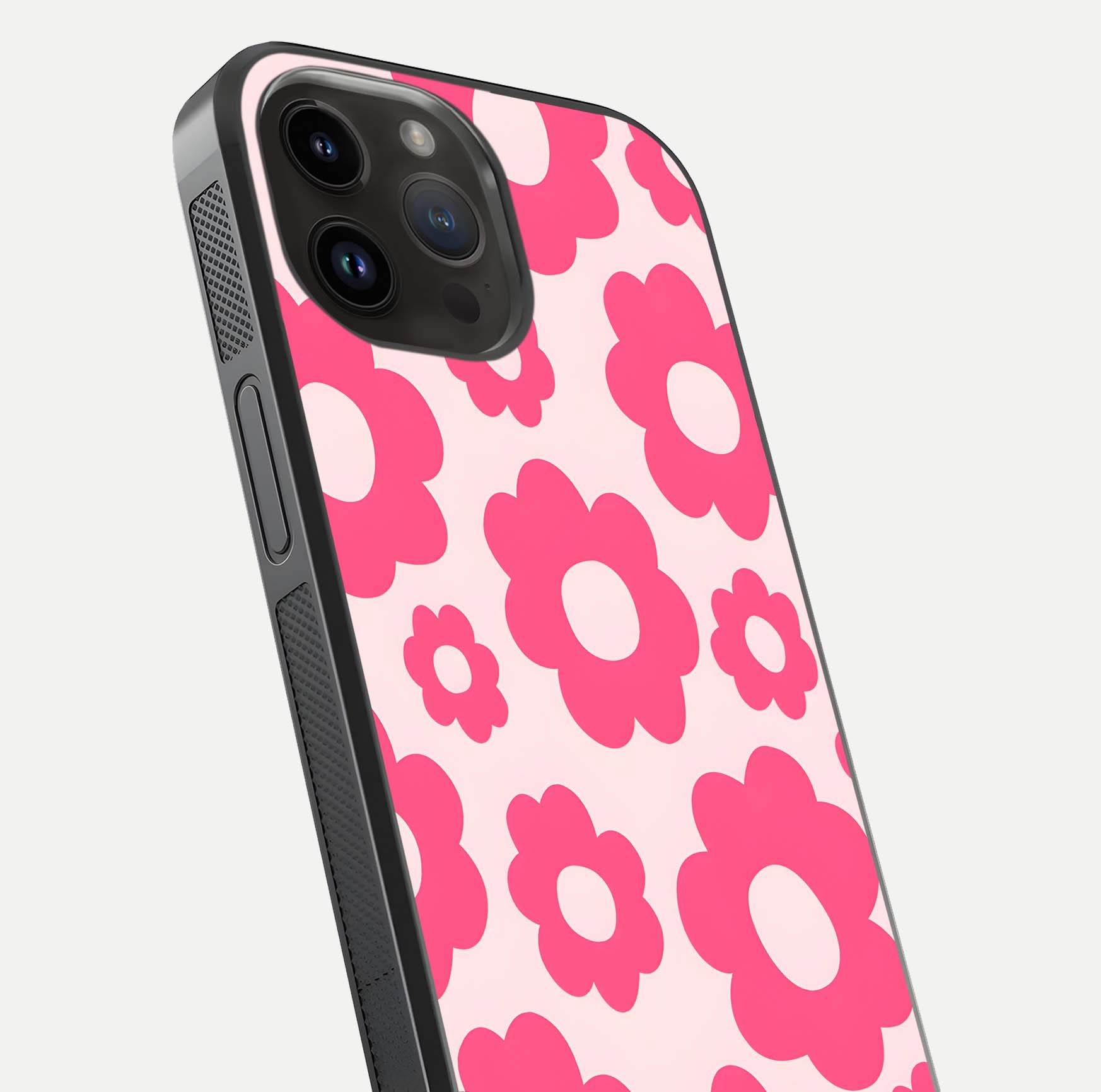 Blush Flower Pop iPhone 14 Pro Max glass phone case angled back view highlighting bright floral pop design and side grip texture